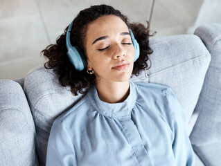 Wall Mural - Woman, face and headphones for listening to music for calm, peace and mindfulness on home couch. Young person on living room sofa listen to podcast, audio or motivation to relax or meditation above