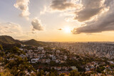 Fototapeta Niebo - Beautiful view from viewpoint to city and sunset clouds