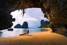 A Man With Surfboard In The Lonely Island In Krabi Thailand