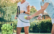 © Delcio/peopleimages.com - Tennis training, women with racket and ball on outdoor turf for sport, instructor or coach with fitness motivation and help. Exercise, sports lesson and workout, teaching and learning skill on court