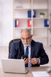 © Elnur - Old male employee and too much work in the office