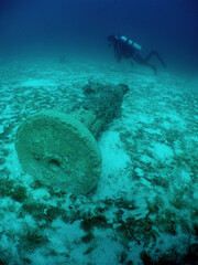 a diver and an ancient underwater relics