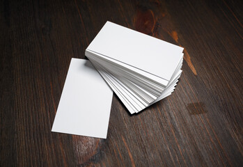 Wall Mural - Blank white business cards on wooden background. Mockup for ID. Template for graphic designers portfolios.