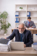 © Elnur - Two male colleagues working in the office