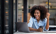 Excited happy african american woman feeling happy rejoicing online win got new job opportunity while using laptop computer.