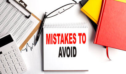 Poster - MISTAKES TO AVOID text on notebook with clipboard and calculator on white background