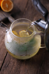 Poster - Sbiten, a drink with lemon, mint and honey in a glass teapot