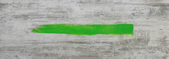 Canvas Print - acrylic green line stroke on wooden background