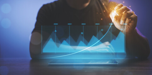 Business analysis, financial investment and technology concept. development to success and growing growth, analyzing financial graph on virtual screen.