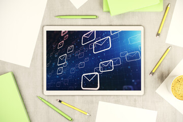 Poster - Top view of modern digital tablet monitor with postal envelopes hologram. Electronic mail and spam concept. 3D Rendering