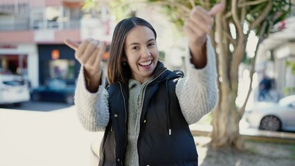 Canvas Print - Young beautiful hispanic woman smiling confident asking for come at park