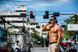 © theartofphoto - Muscular sportsman on Phuket street in Thailand