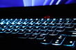 © Natalya Nepran - Close up monitor and backlit keyboard concept photo. Keys with glowing elements.