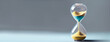 an hourglass on grey background Dead line Banner Space for text on the left
