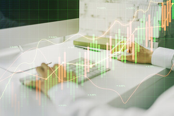 Poster - Multi exposure of abstract financial graph with hand typing on laptop on background, financial and trading concept