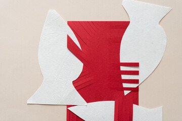 Canvas Print - red card with fringe and white shapes in the form of fish on blank paper