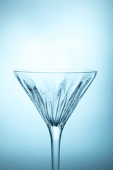 Wall Mural - Elegant empty martini glass on light blue background, closeup. Space for text