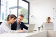 © NT_studio - Young caucasian businessman is entrepreneur training businesswoman working confident together at office, manager and employee discussing and using laptop computer, two people, business concept.