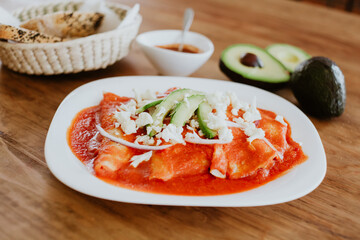 Wall Mural - mexican red enchiladas for breakfast in Mexico Latin America