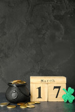 Calendar With Date Of St. Patrick's Day, Pot, Coins And Paper Clover On Dark Background