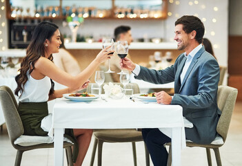 Love, wine and couple toast in restaurant for romantic dinner, honeymoon and anniversary celebration. Valentines day, fine dining and man and woman together for luxury date, alcohol drinks and relax