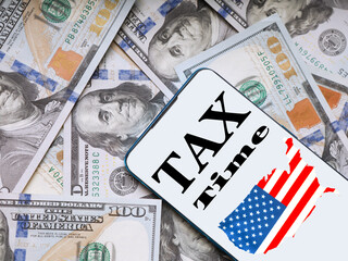 Wall Mural - Mobile application for paying taxes in the USA on the background of dollars
