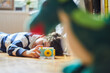 © Cavan Images - A boy takes photos of his toys with his camera