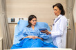© Art_Photo - Senior woman doctor wearing uniform with stethoscope service help support discussing and consulting talk to sick woman patient about checkup result information in hospital.