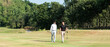 © freebird7977 - Group golf professional Golfer asian man walking in fairway with bag golf at golf  club.  Hobby in holiday and vacation with friends.  Lifestyle and Sport Concept