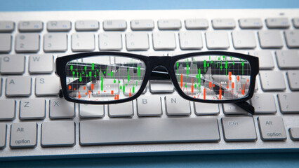 Wall Mural - Stock market statistics on eyeglasses. Forex trading analysis