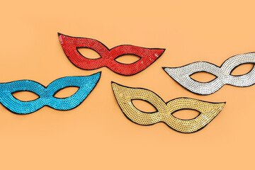 Wall Mural - Holidays image of mardi gras masquarade sequins masks over yellow background. view from above