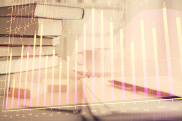 Poster - Double exposure of financial chart drawing and desktop with coffee and items on table background. Concept of forex market trading