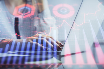 Poster - Double exposure of woman hands typing on computer and financial graph hologram drawing. Stock market analysis concept.