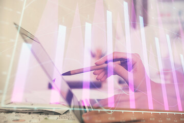 Poster - Multi exposure of woman hands typing on computer and financial graph hologram drawing. Stock market analysis concept.