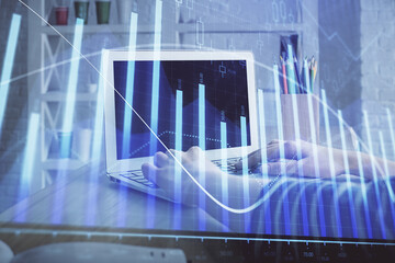 Poster - Double exposure of woman hands typing on computer and forex chart hologram drawing. Stock market invest concept.