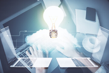 Poster - Double exposure of woman hands typing on computer and light bulb drawing. Idea concept.