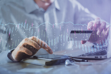 Aufkleber - Double exposure of man hands holding a credit card and Forex graph drawing. Stock trading and digital fintech in Internet E-commerce concept.