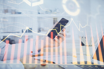 Poster - Double exposure of man's hands holding and using a digital device and forex graph drawing. Financial market concept.