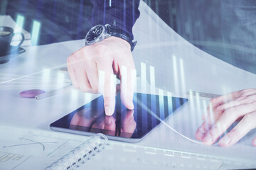 Aufkleber - Double exposure of man's hands holding and using a digital device and forex graph drawing. Financial market concept.
