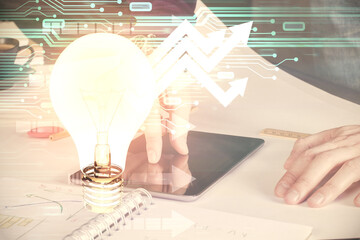Poster - Double exposure of man's hands holding and using a digital device and bulb hologram drawing. Idea concept.