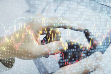 Poster - Multi exposure of man's hands holding and using a phone and financial chart drawing. Market analysis concept.