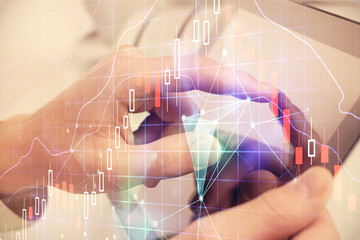 Poster - Multi exposure of man's hands holding and using a phone and financial chart drawing. Market analysis concept.