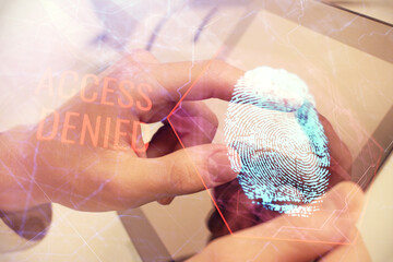 Aufkleber - Double exposure of man's hands holding and using a digital device and fingerprint hologram drawing. Security concept.