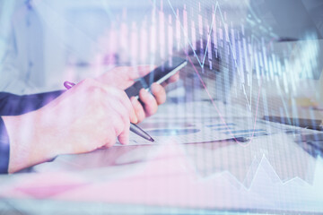 Aufkleber - Double exposure of man's hands holding and using a phone and financial chart drawing. Market analysis concept.
