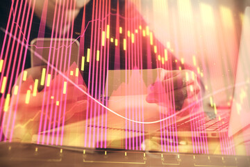Poster - Double exposure of man's hands holding and using a phone and financial graph drawing. Analysis concept.
