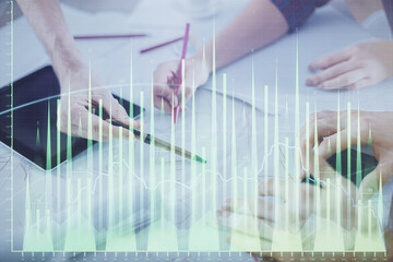 Poster - Double exposure of forex graph drawing and man and woman working together holding and using a mobile device. Trade concept.