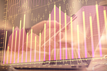 Aufkleber - Double exposure of man's hands holding and using a phone and financial graph drawing. Analysis concept.