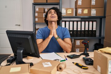 Sticker - Hispanic man with curly hair working at small business ecommerce begging and praying with hands together with hope expression on face very emotional and worried. begging.