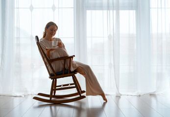 Wall Mural - woman resting on armchair at home