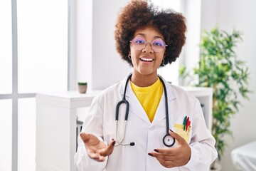 Poster - African american woman wearing doctor uniform speaking at clinic